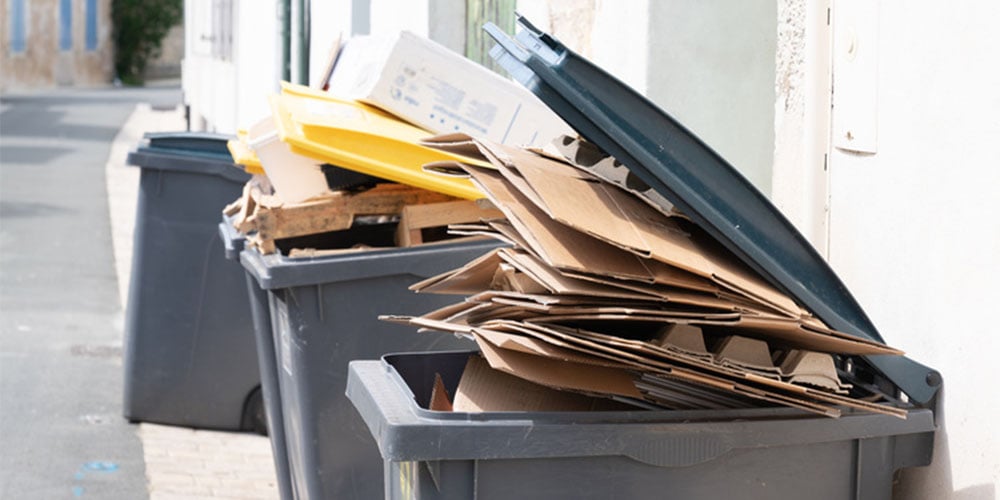 Bin overflowing with cardboard