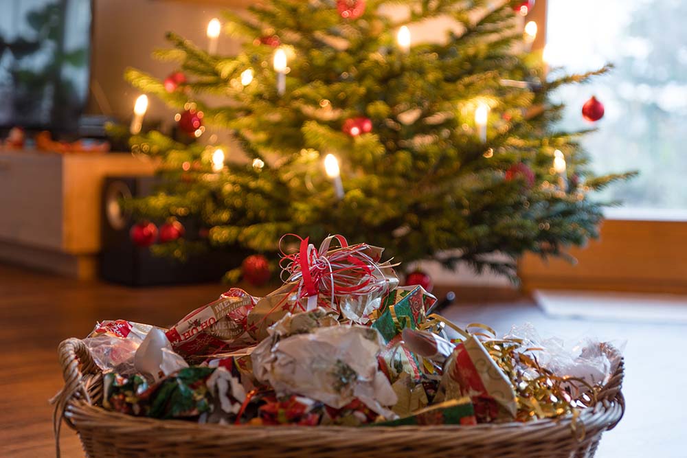 Wrapping paper scrunched up underneath a Christmas tree